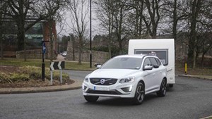 White car towing caravan